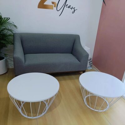 Grey Busking Two-Seater Sofa and White Wire Coffee Table rentals in Dubai and UAE | Qamar Event Rentals