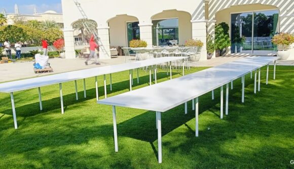 Setup of White Conference Meeting Tables for Event Rentals in Dubai, Sharjah, Abu Dhabi, Ajman, UAE