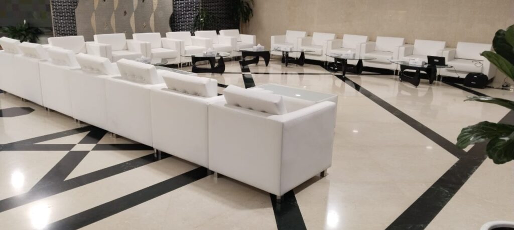 Elegant event setup featuring stylish sofas and modern coffee tables available for rent in Dubai, Abu Dhabi, Sharjah, Ajman, and the UAE. Includes various designs to complement any occasion.