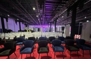 Event setup showcasing Black and Blue Madison Chairs with Silver Poles, Blue Ropes, and Banquet Chairs covered in White, creating a chic and elegant ambiance.