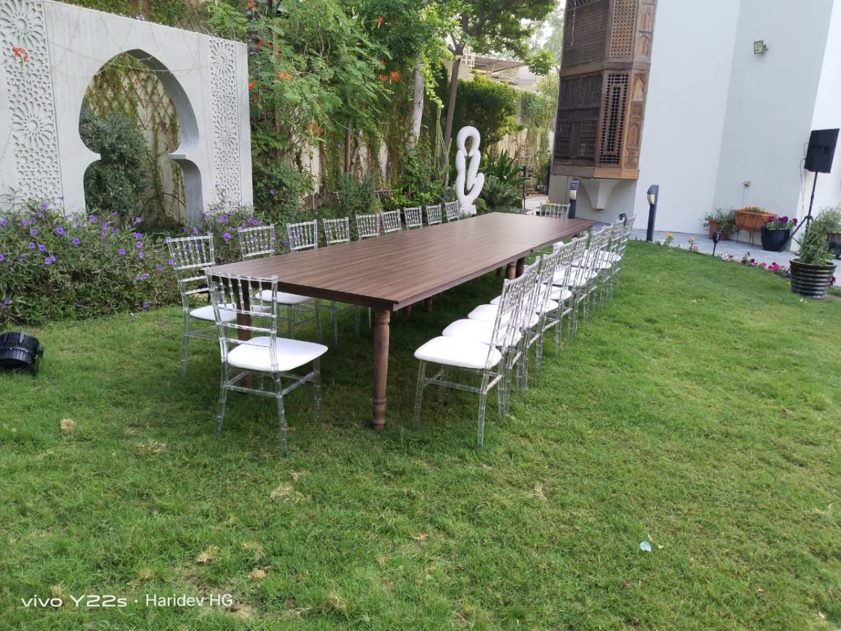 Dining tables and clear acrylic Chiavari chairs available for rent throughout the UAE for various events.