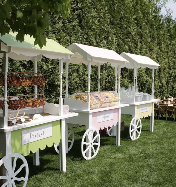 White carts available for rent for setups with snacks, refreshments, desserts, and candy in Dubai, Abu Dhabi, Sharjah, Ajman, and the UAE. Includes options for candy carts, dessert carts, and rustic display carts.