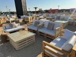 Pallet and crate furniture rental by Qamar Event Rentals: wooden pallet coffee tables and sofas available for events in Dubai and the UAE.