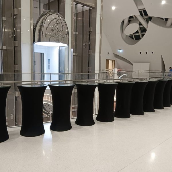 Elegant event setup showcasing the Gloria Cocktail Table with black cover and glass top, offered by Qamar Events for weddings and corporate gatherings in Dubai and across the UAE.