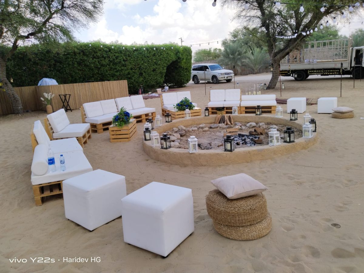 Rectangle Crate Table with glass top, Pallet Sofas, and Ottomans for event rental in Dubai and UAE.