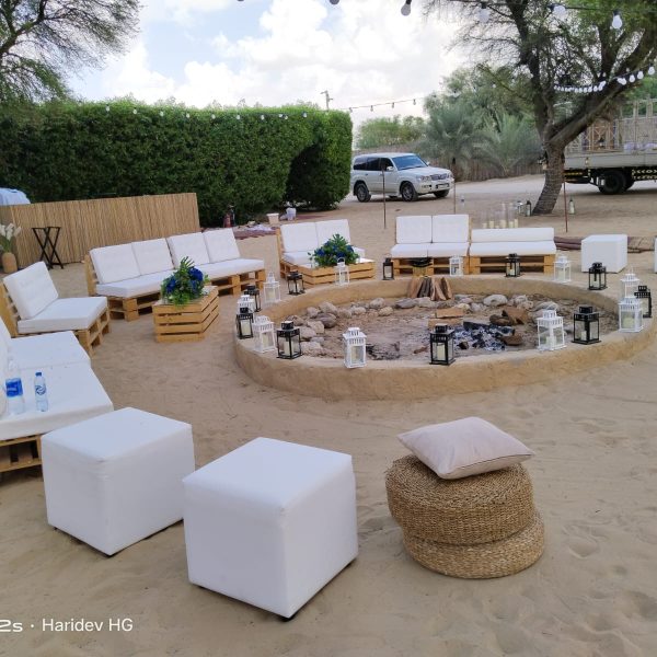 Rectangle Crate Table with glass top, Pallet Sofas, and Ottomans for event rental in Dubai and UAE.