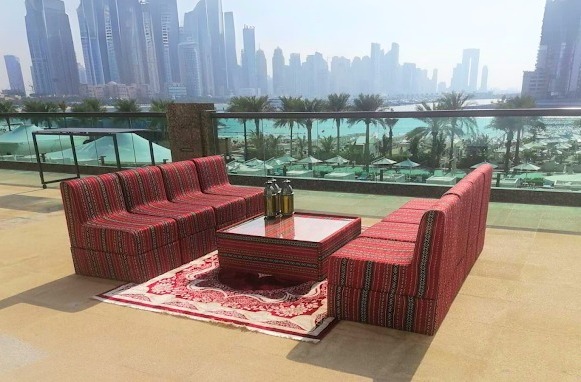 Stunning Arabic Majlis setup featuring elegant sofas, coffee tables, and decorative elements, perfect for events and available for rent across the UAE by Qamar Events.