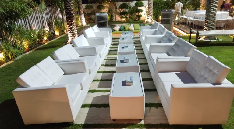 VIP 2 seater sofas with coffee tables and banquet chairs in an elegant setup in Dubai.