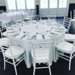 White chiavari chair, plastic chairs, round banquet tables with white covers available for rent in Dubai and Sharjah, perfect for enhancing event setups.