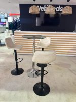 Off-white swivel bar stools paired with coral bar table – luxury event lounge setup in Dubai by Qamar Events